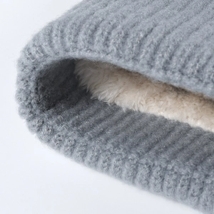 Winter knit beanie for women with warm fleece lining and gray striped texture