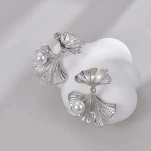 French vintage silver ginkgo leaf earrings with pearls on a white cloud ceramic display