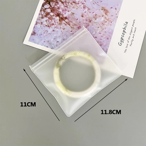 Detail showing 11cm x 11.8cm dimensions for the semi-transparent frosted EVA storage bag