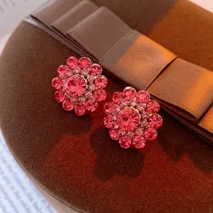 Luxury pink crystal flower stud earrings with sparkling rhinestones in a gold setting
