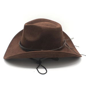 Detail of dark brown faux suede cowboy hat with adjustable chin strap and black band