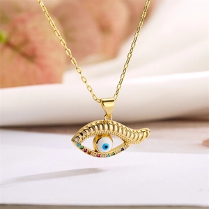 Detailed view of evil eye pendant featuring colorful diamonds on a gold chain