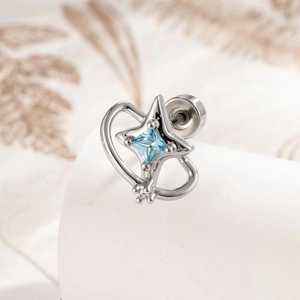 Elegant silver starburst stud earring with aquamarine stone and planetary ring