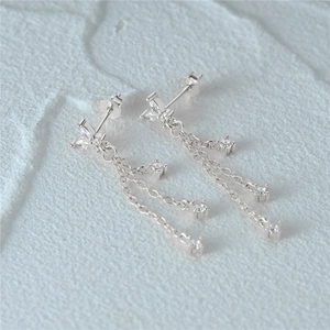 Close-up of S925 sterling silver butterfly tassel earrings with sparkling zircon stones