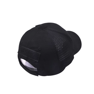 Detail view of black tactical cap showing ripstop fabric and breathable mesh panels