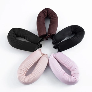 Set of four heatless satin hair rollers in assorted colors with snap buttons