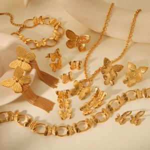 Vintage gold butterfly jewelry set including necklace, earrings, bracelet and ring