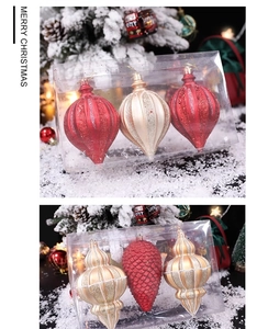 Detailed view of red and gold Christmas ornaments with glitter and matte relief textures