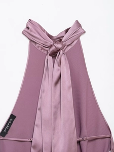 Close-up of elegant mauve satin halter top featuring a stylish knotted neckline detail