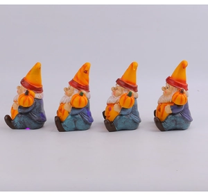 Luminous resin gnomes holding pumpkins for Halloween garden and courtyard decoration