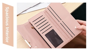 Pink faux leather tri-fold wallet interior with multiple card slots and clear ID window