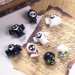 Set of 3D Halloween ghost and skull figurines on vintage paper backdrop