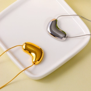 Polished bean pendant necklaces in gold and silver finish with sleek snake chains