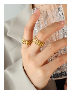 Detail of double-layer chain link ring in matte gold finish worn on finger