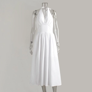 Detail showing white cotton halter maxi dress with deep V-neck and lace-up back design