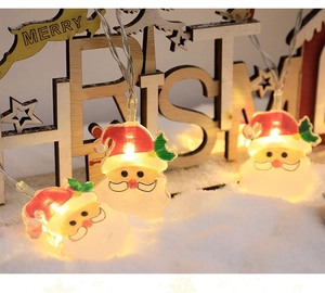 Detailed close-up of LED Santa Claus string lights with warm glow and Merry Christmas decor