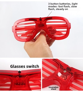 Detail of red shutter LED glasses showing battery compartment and light mode switch
