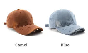 Detail view of camel and blue washed cotton baseball caps with distressed ripped edges