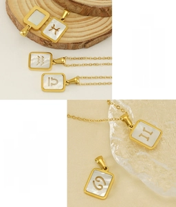 Détail macro du collier zodiaque en acier inoxydable plaqué or 18K avec nacre blanche