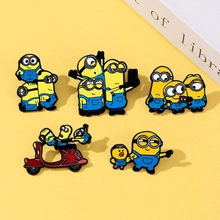 Set of five colorful Minions metal enamel pins featuring various character poses