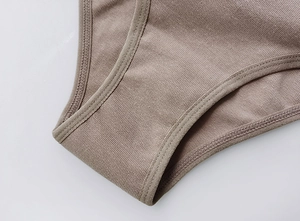 Macro shot of high-elasticity ribbed cotton fabric and reinforced double stitching detail