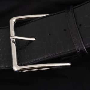 Elegant slim fit knit dress featuring black crocodile textured leather belt with silver buckle