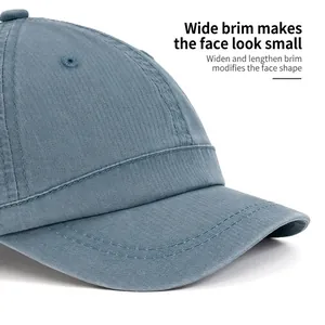 Short brim washed cotton baseball cap in blue-grey with reinforced stitching for sun protection