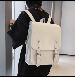Detail view of the white vintage soft PU leather backpack showing adjustable straps and buckles