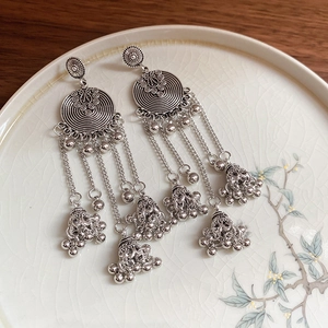 Vintage silver Jhumka earrings with round spiral tops and delicate bell tassels