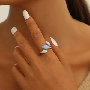 Detail of leaf-shaped open ring with purple, light blue and green decorative pieces