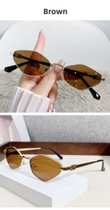 Detail of vintage geometric diamond sunglasses with gold metal frame and brown lenses