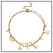 Detail of 18K gold plated beaded anklet with star charms and infinity symbol pendant