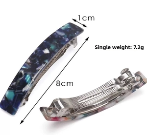 Detail of 8cm blue marble acrylic hair clip showing front and back metal spring
