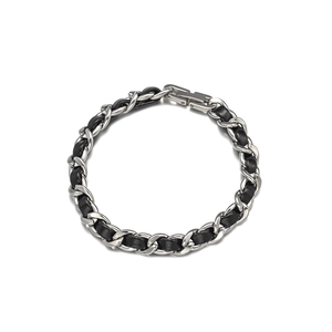 Minimalist silver chain bracelet woven with black leather featuring a sleek metal clasp