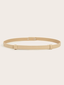 Close-up of beige thin leather belt with cross-grain texture and double rivet buckle