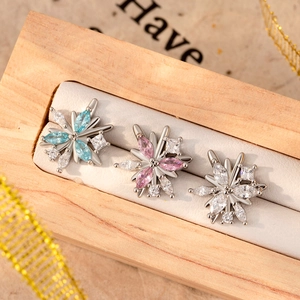 Snowflake stud earrings with colorful cubic zirconia stones in a luxury gift box