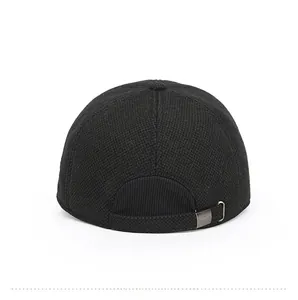 Rear view of black knit baseball cap showing textured fabric and silver metal buckle