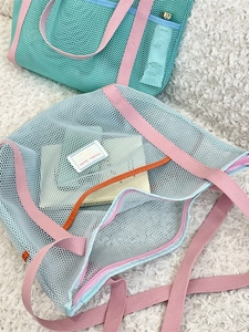 Dual-color mesh beach tote bag in light blue and mint green with pink straps
