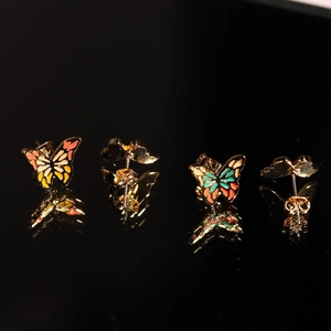 Vintage gold butterfly stud earrings with colorful enamel wings and mirror reflections