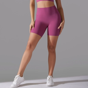 Close-up of high-waisted seamless fitness shorts in deep magenta for yoga and running