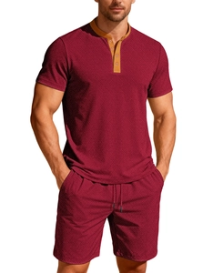 Close-up of men's burgundy lounge set showing textured jacquard fabric and buttoned collar