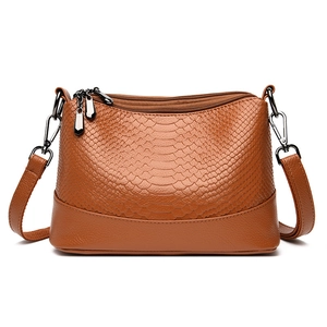 Brown snake-embossed PU leather crossbody bag for women with dual zipper and shoulder strap