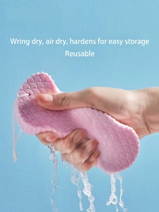 Pink soft baby bath sponge with fish scale texture and lanyard for skin exfoliation