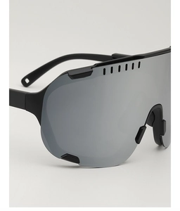 Close-up of matte black cycling sunglasses featuring silver mirrored lenses and large frame