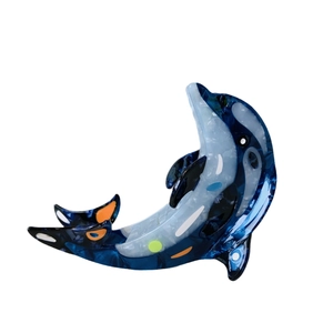 Ocean-inspired dolphin hair claw clip made of blue and white marble-textured acetate