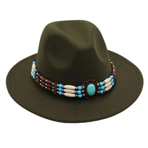 Detail of bohemian turquoise beaded hatband on a vintage dark green felt fedora hat