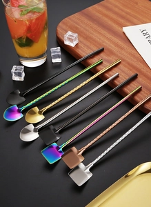 Colorful 304 stainless steel straw spoons in square and round shapes on a dark surface