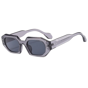 Modern polygonal grey transparent sunglasses with dark lenses and curved temples for women