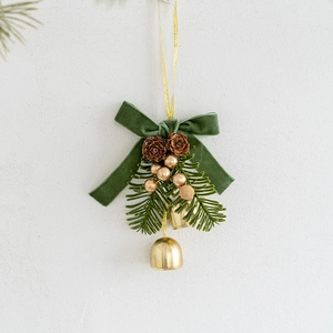 Christmas hanging ornament with green velvet bow, gold bells, pine cones and pine needles
