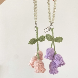 Handmade crochet lily of the valley keychain with pink purple flowers and pearl strap